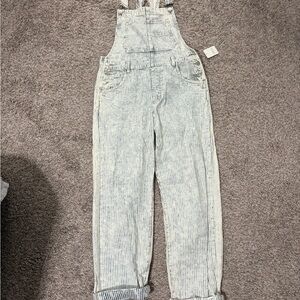 Free People Blue and white overalls. New with tag. Never been worn.